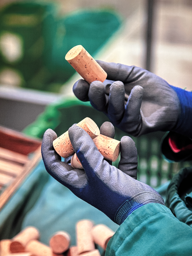 photo of gloved hands holding cork