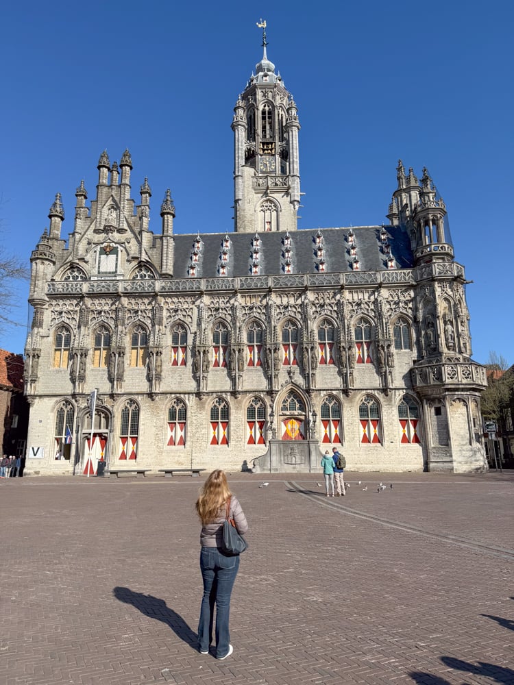 Rachelle looking at a church in Middleburg during the Tulips and Windmills river cruise