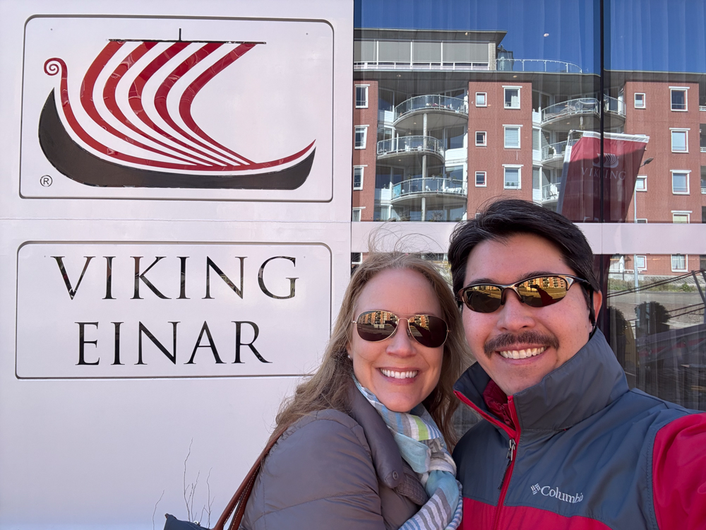 Rachelle and Pete taking a selfie in front of the Viking Einar.