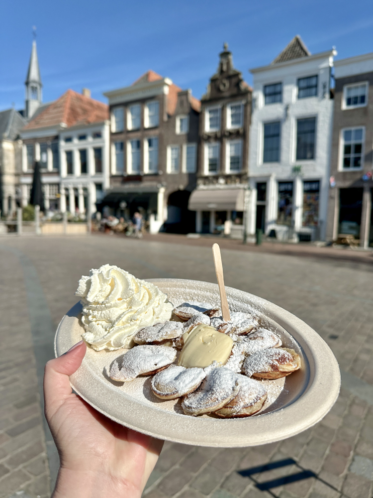 Dutch pancakes with powdered sugar and whipped cream in Zierikzee
