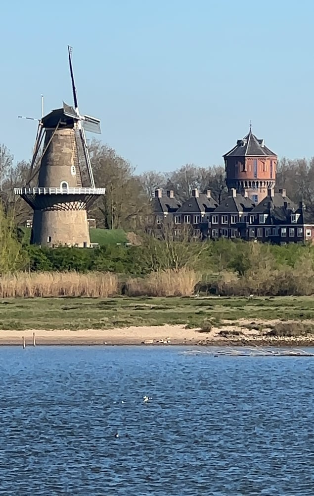 Old vintage windmill seen along the river during the Tulips and Windmills river cruise