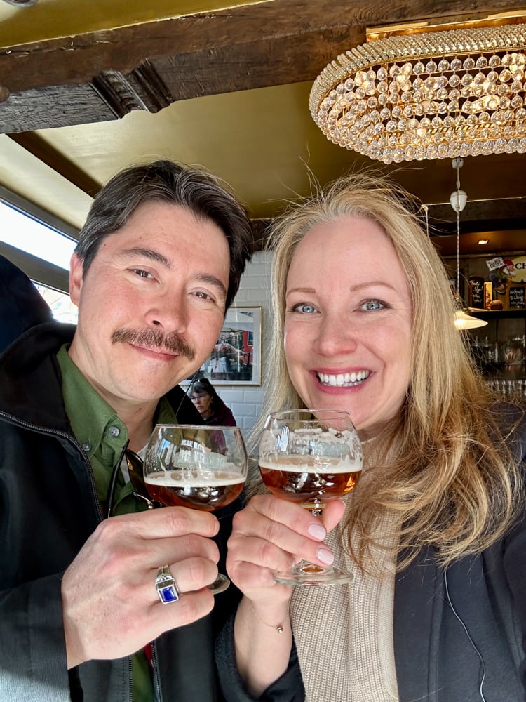 Pete and Rachelle sipping beer in a pub in Antwerp on a Belgium Food Tour