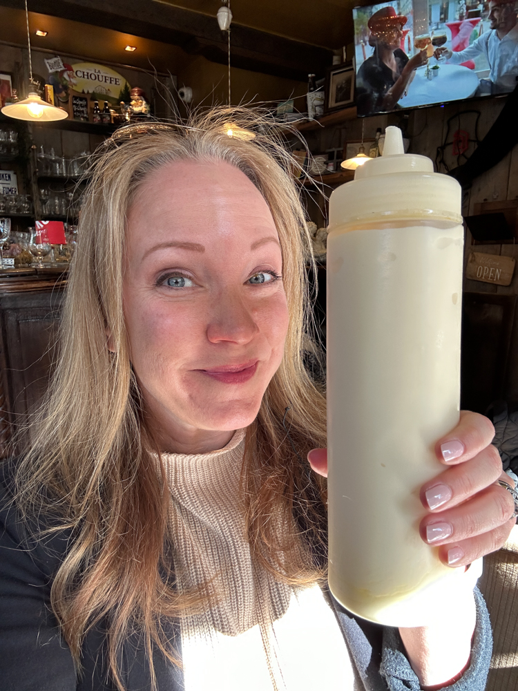 Rachelle holding a big bottle of mayo